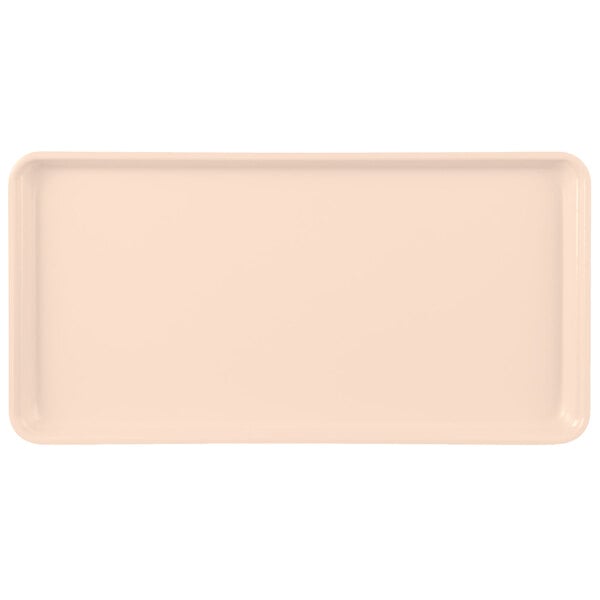 A rectangular white fiberglass MFG Tray display tray with a light beige surface.
