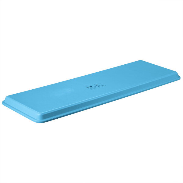 A sky blue rectangular MFG Tray with text on it.