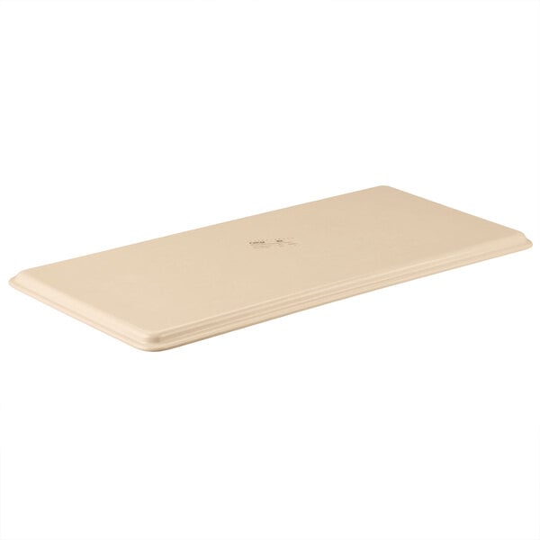 A beige rectangular fiberglass MFG Tray with a logo on it.