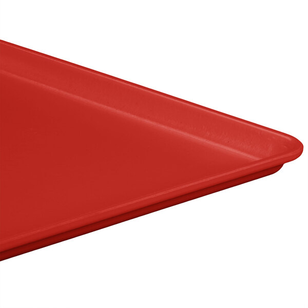 A red MFG Tray Supreme display tray on a table.