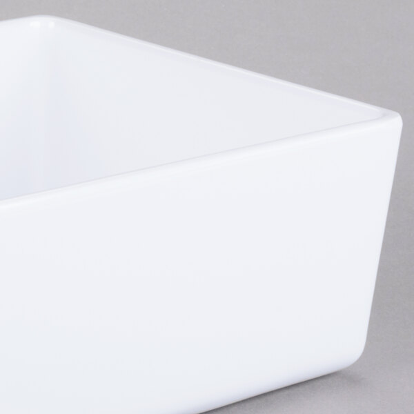 A Tablecraft white melamine straight sided bowl.