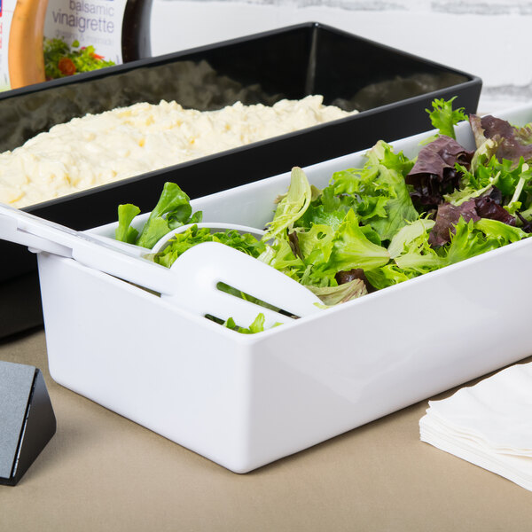 A white Tablecraft melamine container with salad on a salad bar counter.