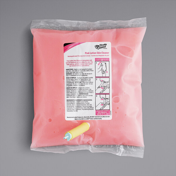 A pink Kutol lotion in a bag with a yellow stick in it.