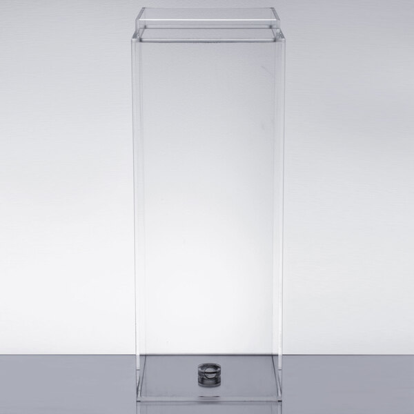 A clear acrylic chamber with a metal ring on top.