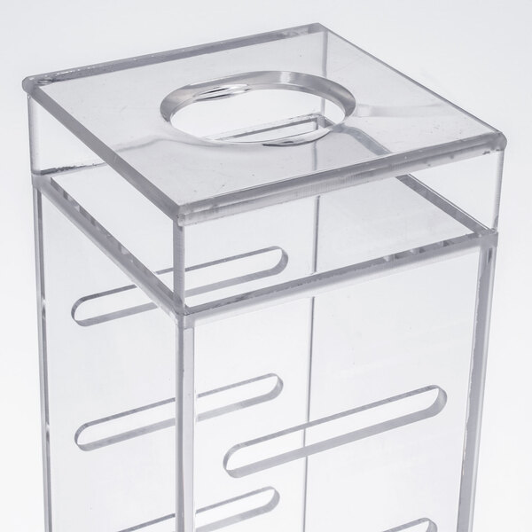 A clear plastic box with a hole in the middle.