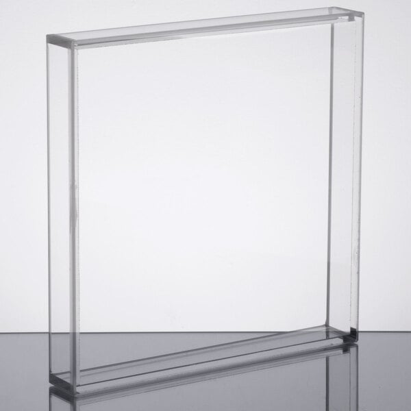 A clear rectangular Cal-Mil beverage dispenser lid on a surface.