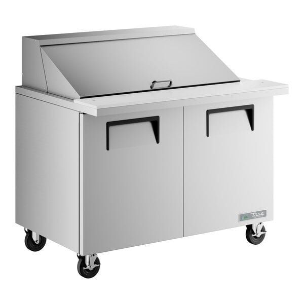 A True stainless steel refrigerated sandwich prep table with two doors.