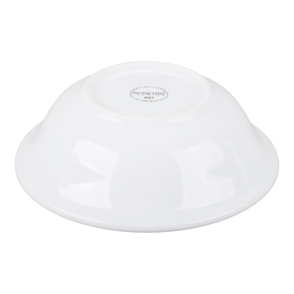 A white porcelain bowl shown upside down on a white background.