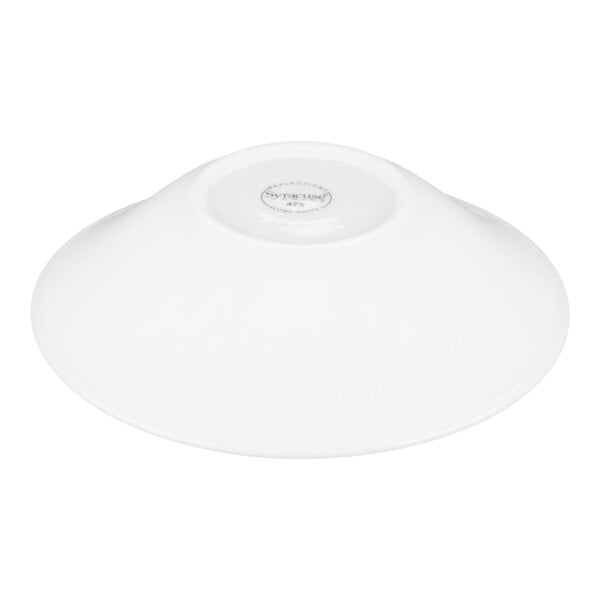 A white, shallow bowl shown upside down with a small circular base visible at the center.