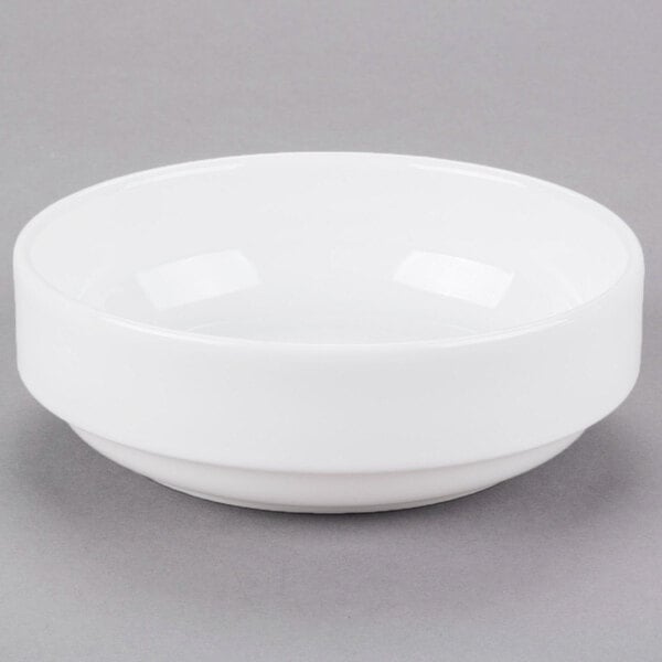 A Libbey Reflections white porcelain bowl on a gray surface.