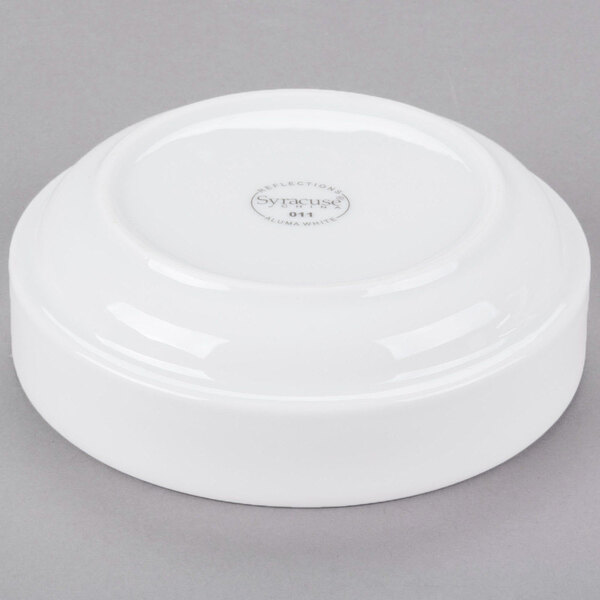 A white Libbey porcelain bowl with a logo on it.