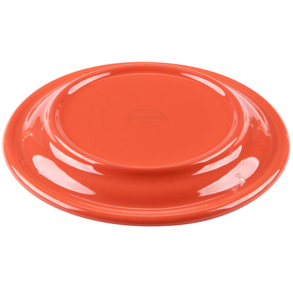 A red Libbey Cantina porcelain saucer with a white background.