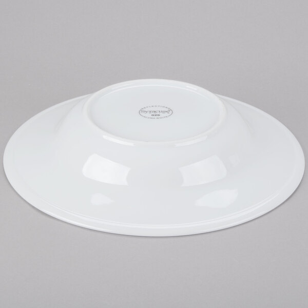 A Libbey white porcelain pasta bowl with a circular rim on a gray surface.