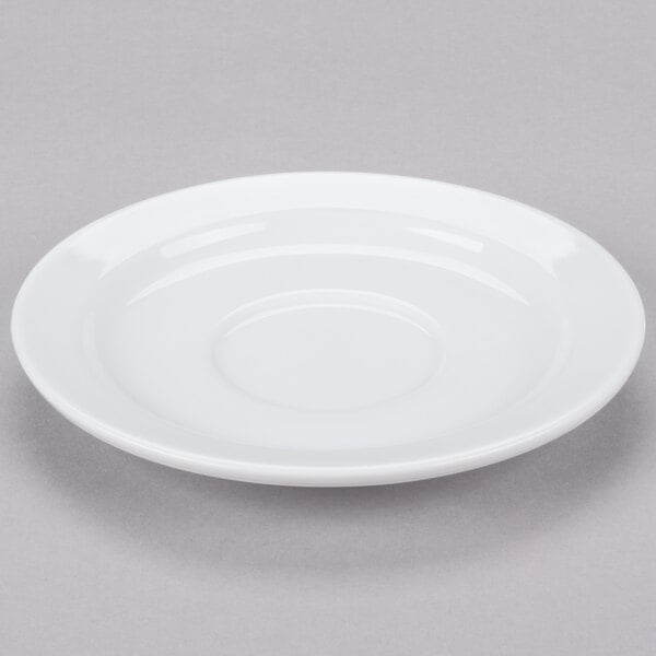 A white Libbey porcelain tea saucer with a circular edge.