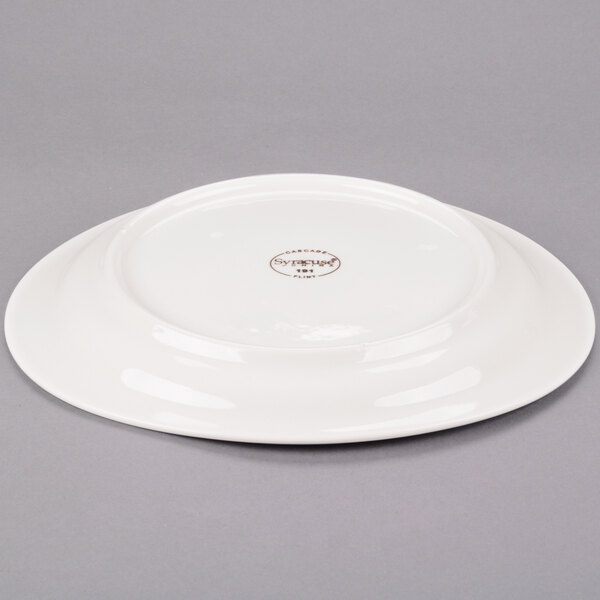 A Libbey ivory porcelain oval plate with a medium rim.