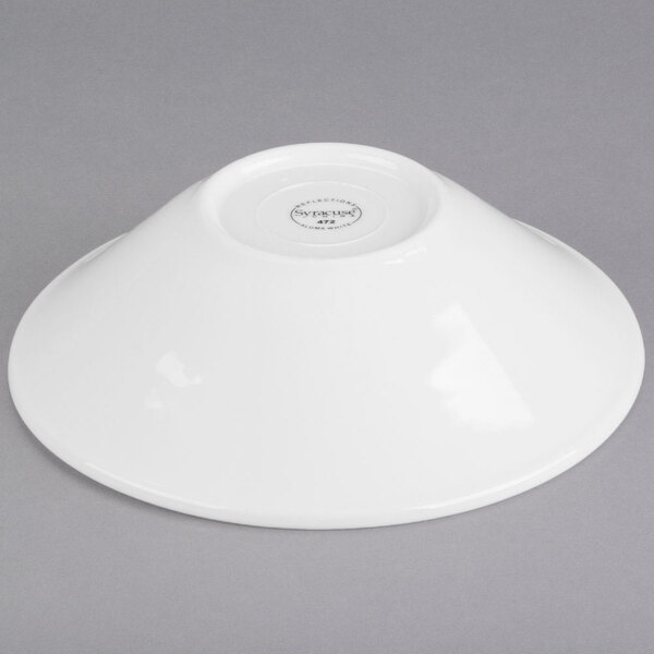 A white Libbey porcelain soup/salad bowl on a gray surface.