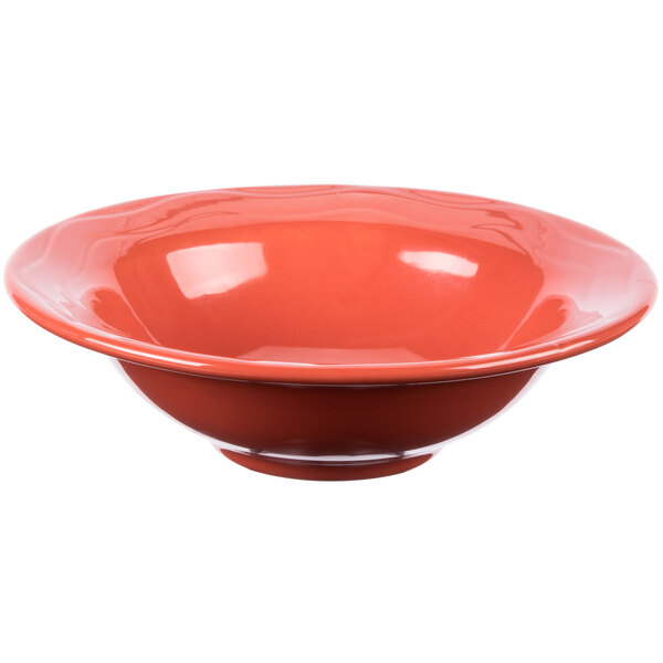 A white Libbey porcelain bowl with a red rim.