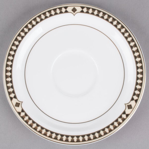 A white Syracuse China saucer with brown and black Baroque design.