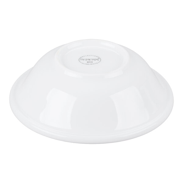 A white porcelain bowl shown upside down on a plain background.