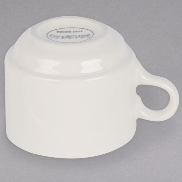 A Libbey Savoy flint porcelain stacking cup in ivory with a handle.