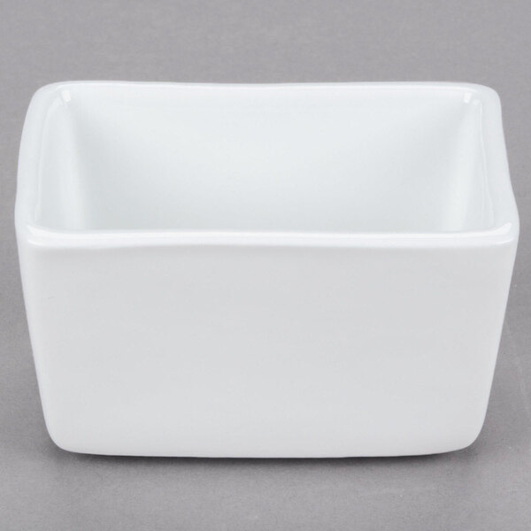 A white rectangular Libbey porcelain sugar caddy with a lid on it.