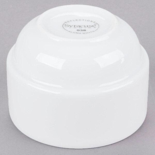 A white round Libbey porcelain bouillon cup with a logo on it.