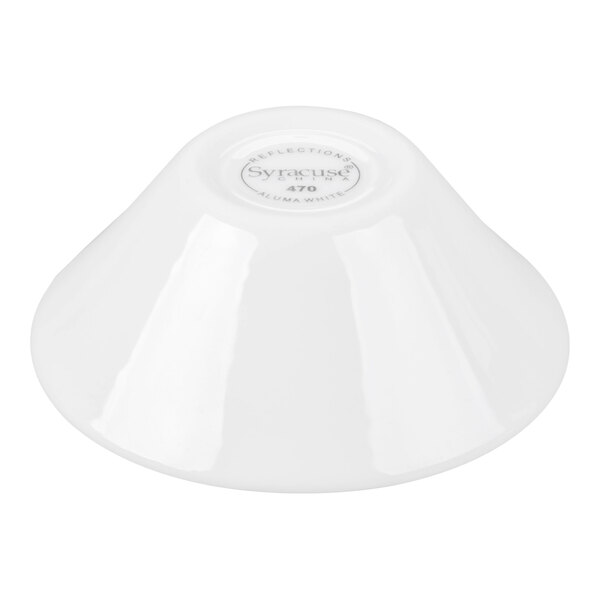 A white porcelain bowl shown upside down with a circular label on the bottom.