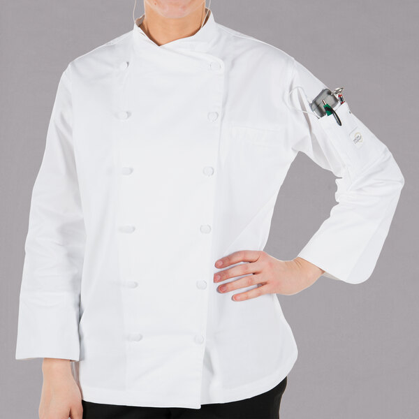 A woman wearing a white Mercer Culinary chef coat.