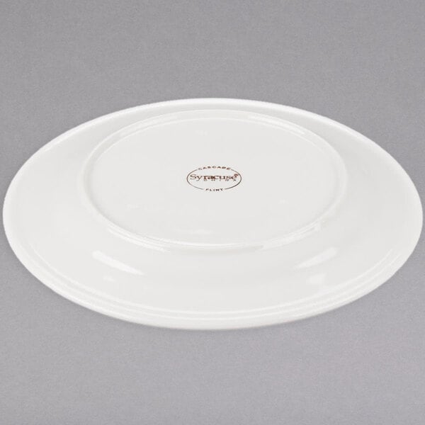 A white porcelain plate with a medium rim.