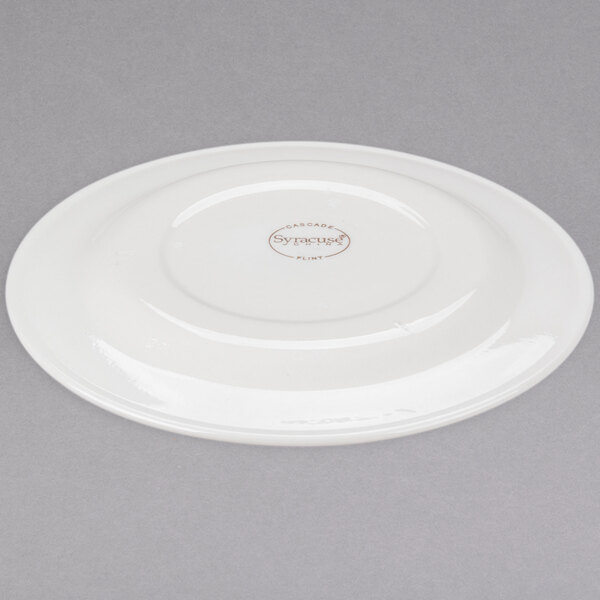 A Libbey ivory porcelain plate with a circular design on the rim.