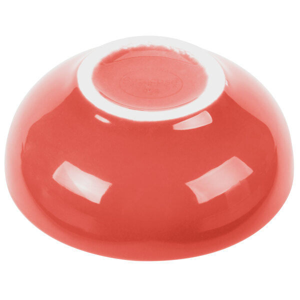 A white bowl with a red rim.