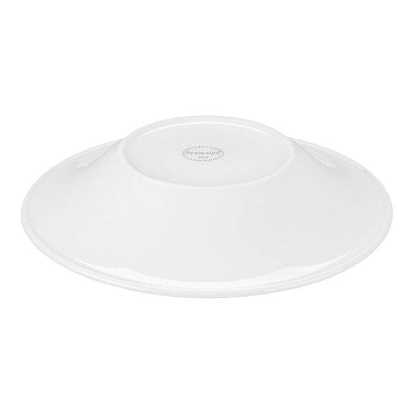 A white porcelain bowl shown upside down, displaying its broad rim and a small circular base with a printed mark.