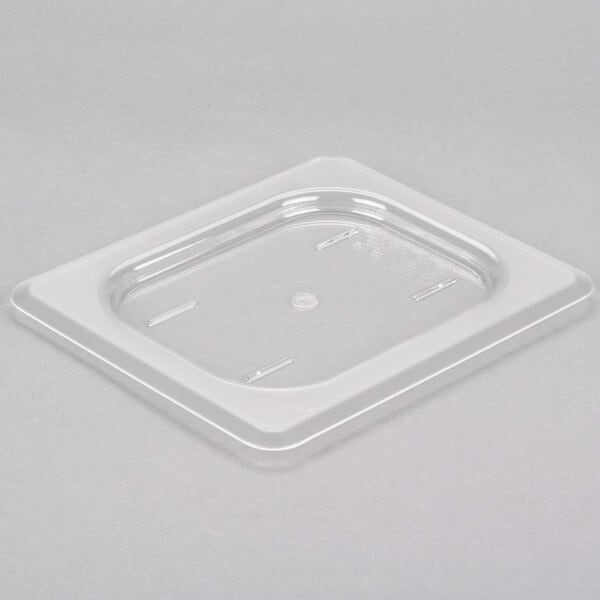 A clear plastic container with a Cambro lid on top.