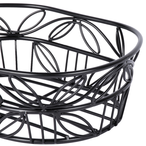 An American Metalcraft black wrought iron oval basket with a leaf design.