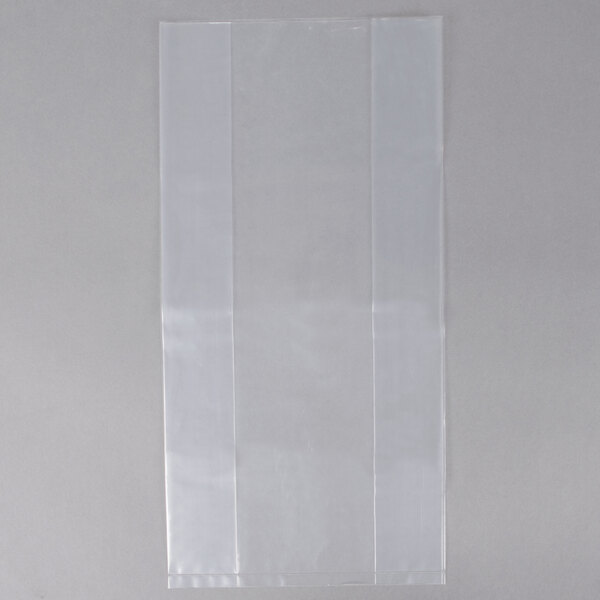 A close-up of a clear plastic bag with a black border containing a white rectangular object.