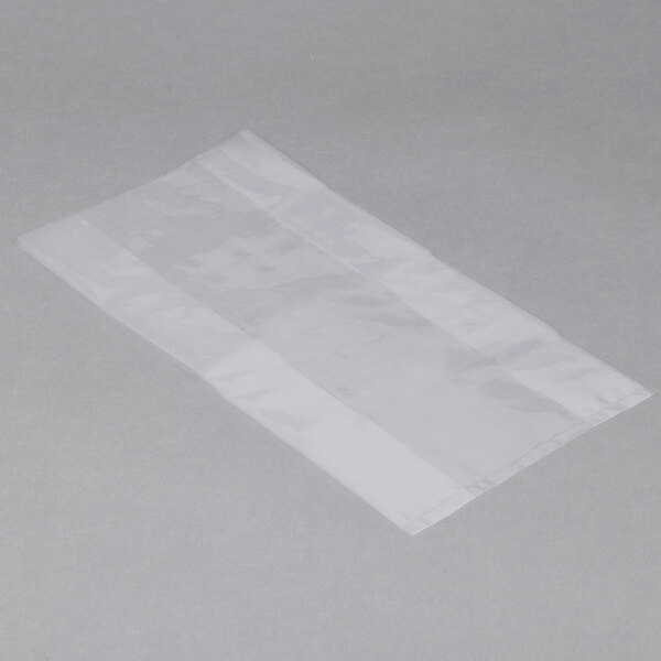A clear plastic bag of LK Packaging on a grey surface.