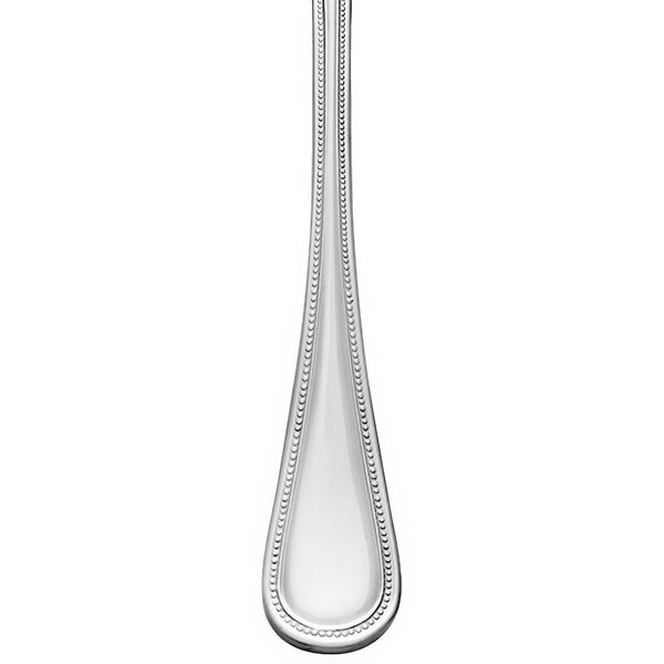 A Libbey Calais stainless steel salad fork with a long handle.