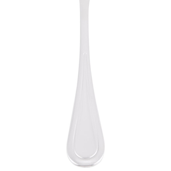 A close-up of a Libbey stainless steel bouillon spoon.