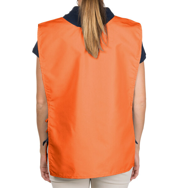 An orange Intedge cobbler apron with two pockets.