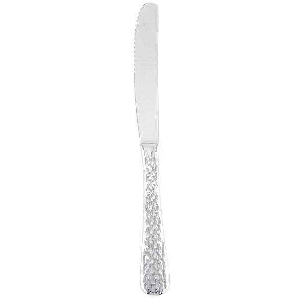 A Libbey stainless steel dinner knife with a fluted handle on a white background.