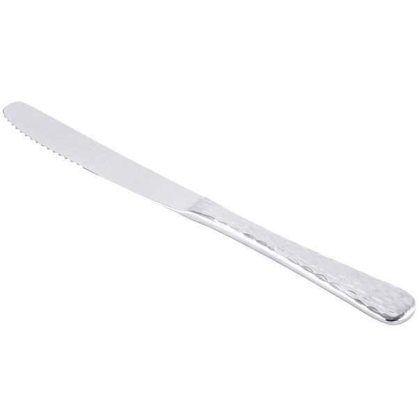 A Libbey stainless steel dinner knife with a fluted blade and solid silver handle.