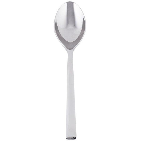 A Libbey stainless steel dessert spoon with a white handle and a silver spoon.