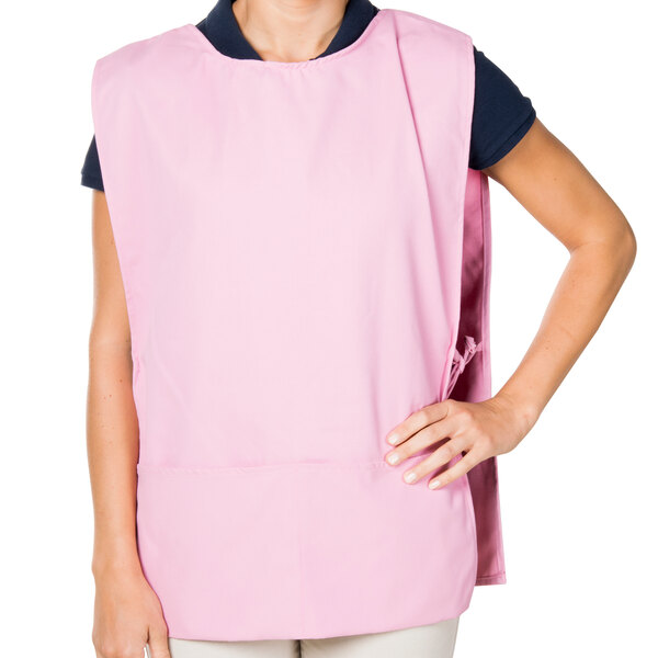 A woman wearing a pink Intedge cobbler apron.