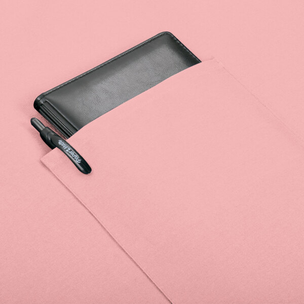 A mauve Intedge bistro apron with a black pen in a pocket.