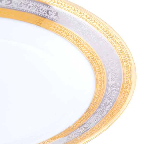A 10 Strawberry Street Elegance porcelain salad/dessert plate with a gold rim.