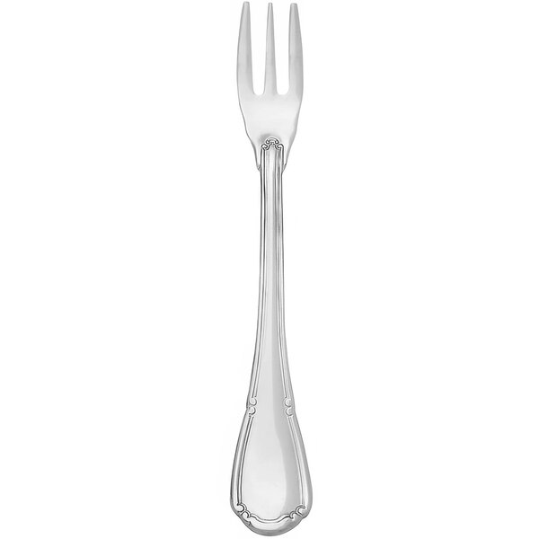 A silver fork with a Baroque design on the handle.
