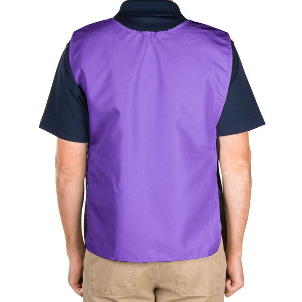 A man wearing a purple Intedge cobbler apron with 2 pockets.