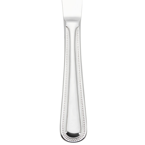 A Libbey stainless steel dinner knife with a beaded design on the handle.