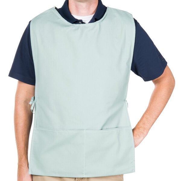 A man wearing a sea green Intedge cobbler apron.