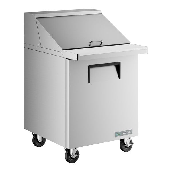 A True stainless steel refrigerated sandwich prep table with wheels.